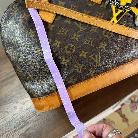 Louis Vuitton Brown and Tan Monogram with strap and keychain charm - Picture 11 of 13